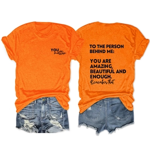 Detail of orange cotton t-shirt featuring YOU matter chest print and back graphic text