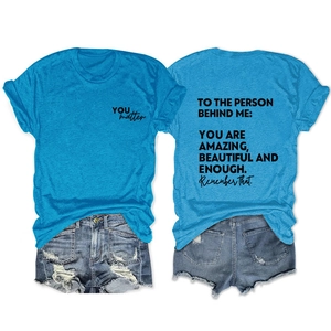 Front and back detail of peacock blue T-shirt with inspirational text and denim shorts