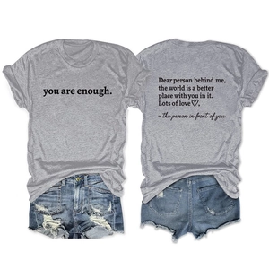 Front and back detail of a grey 'you are enough' T-shirt with blue denim shorts