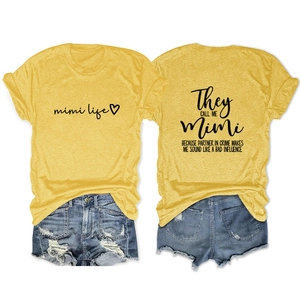 Flat lay detail showing front and back print of yellow Mimi Life cotton t-shirt