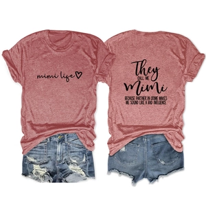 Flat lay of casual red knit T-shirt featuring Mimi Life print and ripped denim shorts