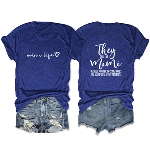 Detail of royal blue Mimi t-shirt paired with distressed denim shorts on white background