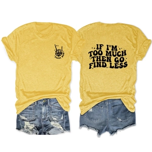 Detail view of yellow t-shirt with IF I'M TOO MUCH THEN GO FIND LESS quote and denim shorts