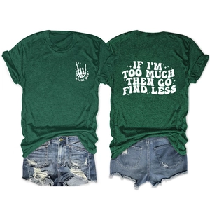 Close-up of IF I'M TOO MUCH print on dark green t-shirt with ripped denim shorts