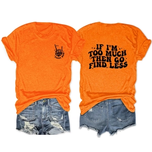 Flat lay of an orange cotton T-shirt with Sassy Mom print and ripped denim shorts