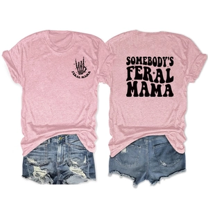 Detail of pink cotton T-shirt featuring Somebody's Feral Mama back print and denim shorts
