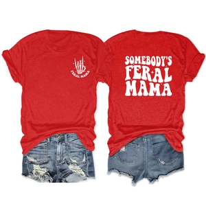 Flat lay view of red Feral Mama t-shirt with skeleton hand print and denim shorts