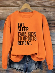 Sweat orange avec slogan EAT SLEEP TAKE KIDS et détails de poignets côtelés