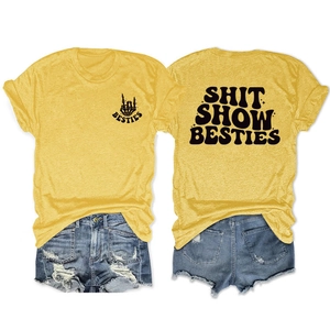 Close-up of Besties print on yellow cotton t-shirt with denim shorts outfit