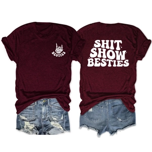 Front and back view of burgundy cotton T-shirt with SHIT SHOW BESTIES white graphic print