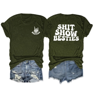 Flat lay of army green Besties T-shirt and distressed denim shorts set with back print