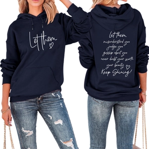 Detailed views of navy blue hoodie with Let Them heart print and back quote text