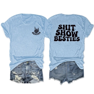 Flat lay view of sky blue T-shirt with Shit Show Besties print and denim shorts
