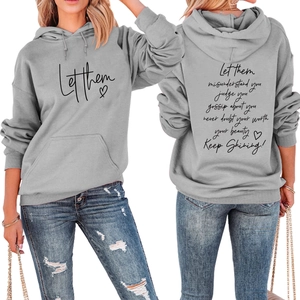 Detail of grey hoodie showing ribbed cuffs, kangaroo pocket, and let them print