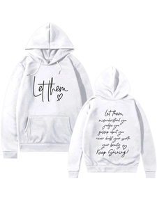 Close-up of white hoodie featuring a kangaroo pocket and motivational text print
