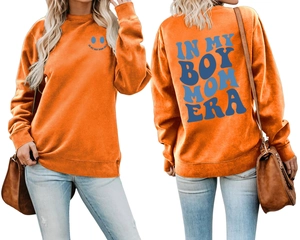 Front and back detail of orange Boy Mom Era sweatshirt with blue lettering and smiley face