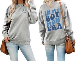 Detail view of the blue 'IN MY BOY MOM ERA' print and ribbed cuffs on grey sweatshirt