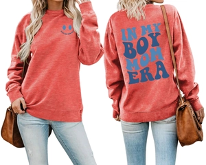 Detailed view of red crewneck sweatshirt with blue In My Boy Mom Era printed slogans