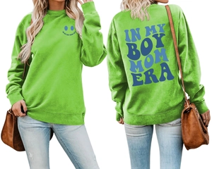Detail view of grass green sweatshirt with In My Boy Mom Era prints on front and back