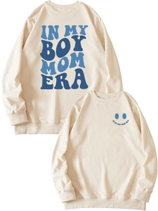 Detail of blue In My Boy Mom Era text print on beige cotton blend long sleeve sweatshirt