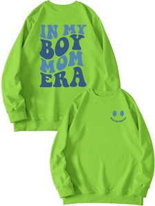 Detail of green boy mom era sweatshirt featuring ribbed cuffs and artistic blue lettering