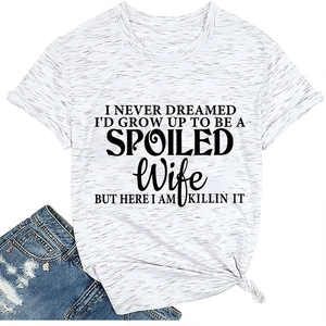 Detail of white cotton T-shirt with black slogan print and stylish front knot hem design