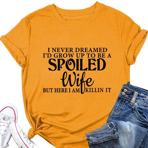 Detail of yellow cotton t-shirt with black slogan print paired with denim shorts