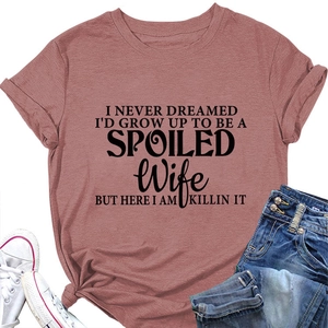 Detail of round neck T-shirt with slogan print and stylish front knot in rose pink