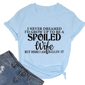 Detail of light blue cotton T-shirt featuring black letter print and side knot design