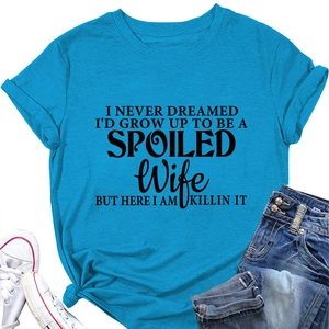Close-up of text print on blue crew neck T-shirt with stylish side knot detail