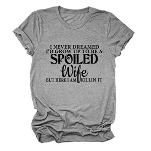 Close-up of grey crew neck T-shirt featuring black spoiled wife slogan print