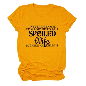 Detail of mustard yellow cotton T-shirt featuring black motivational letter print