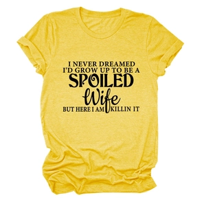 Flat lay of yellow cotton t-shirt with black SPOILED WIFE printed slogan design