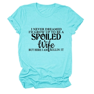 Detail of blue crewneck T-shirt with black spoiled wife slogan print and cotton texture