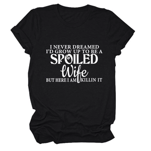 Detailed flat lay of black cotton t-shirt featuring bold white typography print design