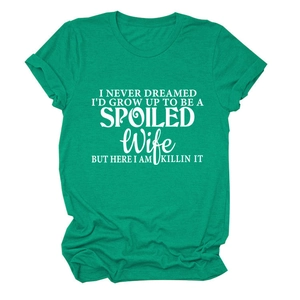 Detail of white printed slogan on green cotton crewneck T-shirt with rolled sleeves