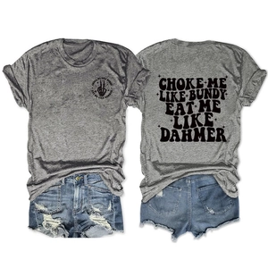 Flat lay of gray graphic T-shirt and distressed denim shorts in American street style