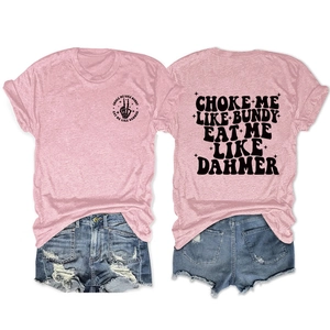 Flat lay of pink cotton T-shirt with double-sided graphic and frayed denim shorts