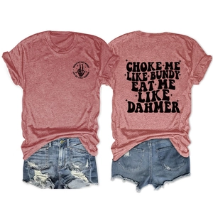 Flat lay view of rust red graphic t-shirt and distressed denim shorts with back print