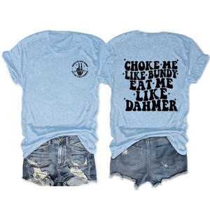 Flat lay of light blue printed T-shirt and distressed denim shorts summer outfit set