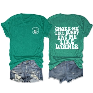 Detail of green heathered T-shirt with vintage back graphic and distressed denim shorts