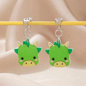 Cute green dinosaur clip-on earrings for kids with soft pads on champagne velvet