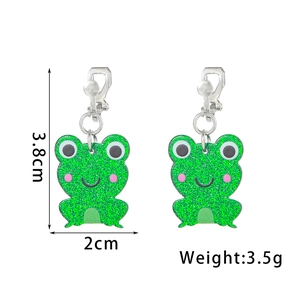 Detailed size view of green frog clip-on earrings with glitter acrylic finish