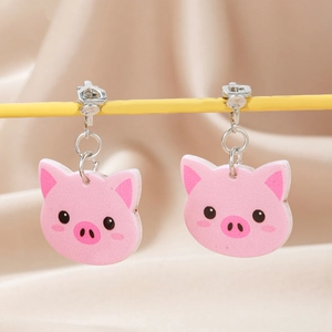 Detail view of cute pink piglet acrylic clip-on earrings with comfortable metal screw back