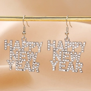 Macro shot of silver alloy Happy New Year earrings with sparkling rhinestone crystals