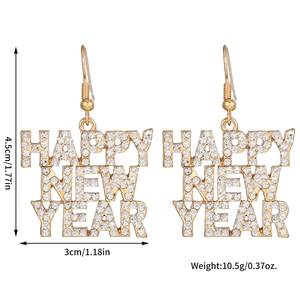 Close-up of gold alloy New Year earrings featuring rhinestones and HAPPY NEW YEAR lettering