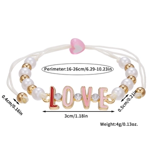 Detailed view of woven pearl bracelet featuring pink LOVE enamel letters and crystals