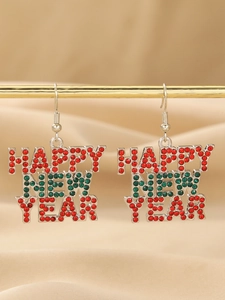 Macro shot of silver alloy earrings with red and green rhinestones reading HAPPY NEW YEAR