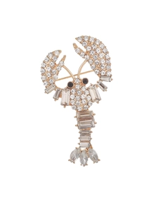 Detailed close-up of lobster brooch featuring gold plating and sparkling crystal rhinestones