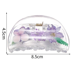 Minimalist geometric hair claw with real dried flowers in transparent eco-friendly resin